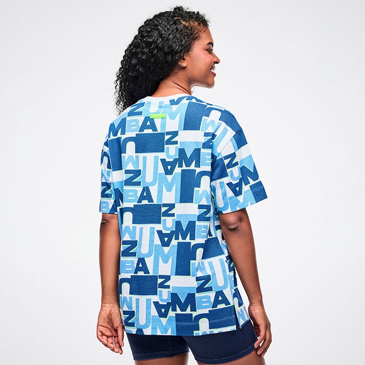 ズンバ　ZUMBA シャツ　公式　正規品　L ZUMBA ズンバ 正規品 ウェアユニセックス Tシャツ 半袖 総柄 ロゴ 丸首