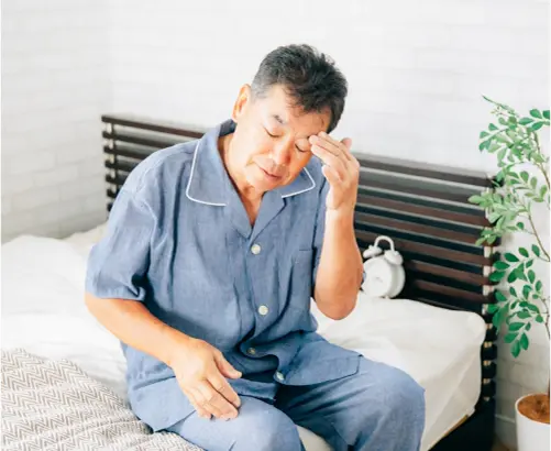 調子の悪そうな男性の写真